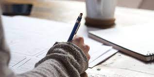 woman hand holding pen and training on writing 
